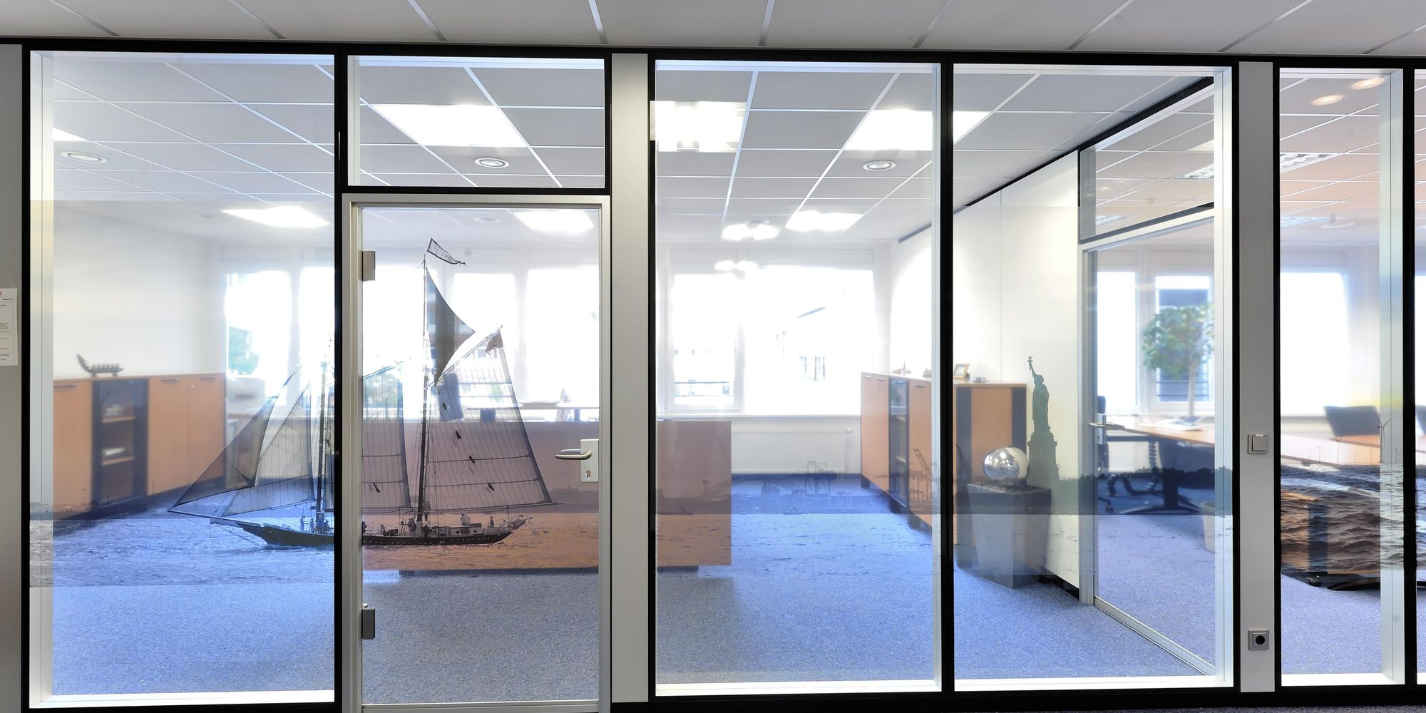 All-glass door with individual decorative foil