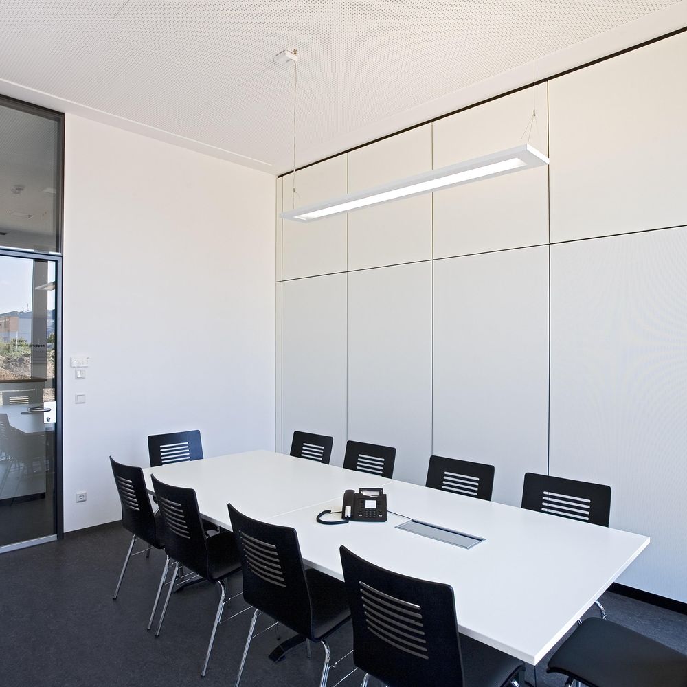 Improved room acoustics with T10 partition system and microperforated acoustic panels